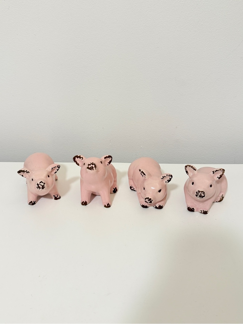 Set of Four Pink Ceramic Pig Figurines